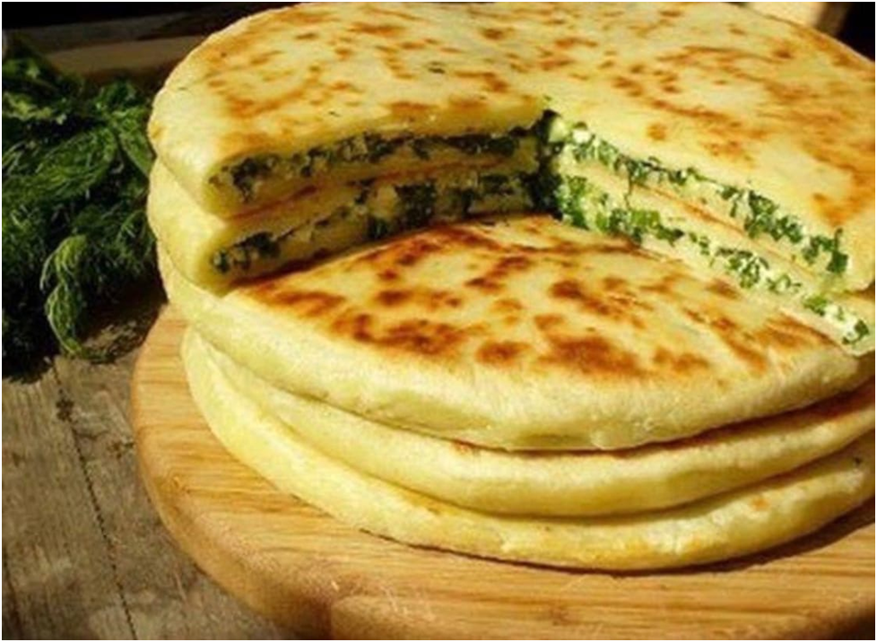 хычины с творогом и зеленью на сковороде