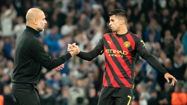    Хосеп Гвардиола и Жоау Канселу. Global Look Press