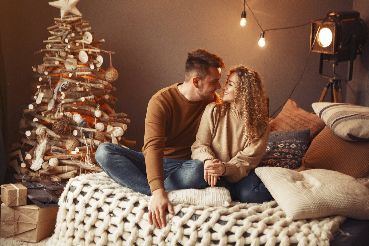 https://www.freepik.com/free-photo/elegant-couple-sitting-home-near-christmas-tree_11243645.htm