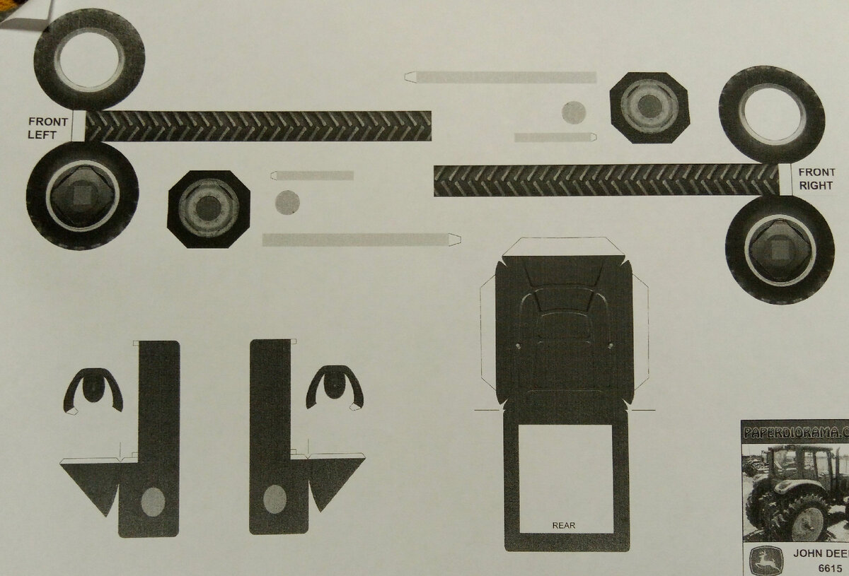 Первый листа развертки модели из бумаги трактора John Deere 6615. Личное фото.