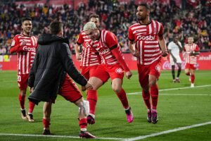    GIRONA, SPAIN - JANUARY 14: Yangel Herrera of Girona FC celebrates with teammates after scoring the team's second goal during the LaLiga Santander match between Girona FC and Sevilla FC at Montilivi Stadium on January 14, 2023 in Girona, Spain. (Photo by Alex Caparros/Getty Images) Даниил Кугушев