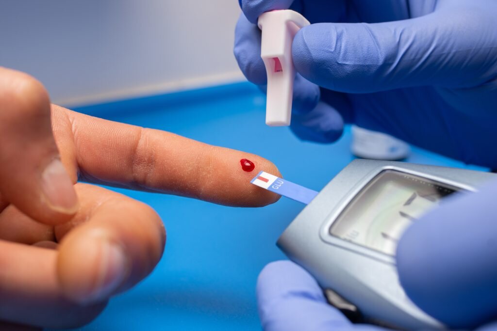    A closeup shot of a doctor with rubber gloves taking a blood test from a patient GxP News