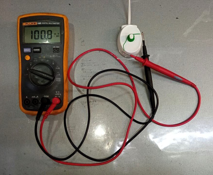 Простой метод проверки станции зарядки электрощётки Braun Oral-B. Тринадцать витков жилы от витой пары дают ~100 мВ.