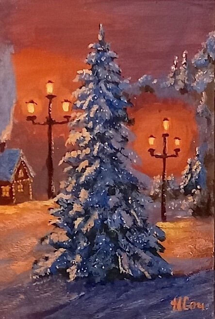 Елочка, уккутанная снегом, в свете фонарей