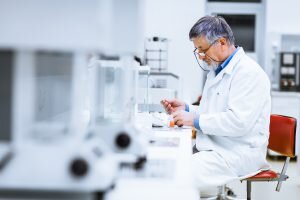    Senior male researcher carrying out scientific research in a lab (shallow DOF; color toned image) Даниил Кугушев