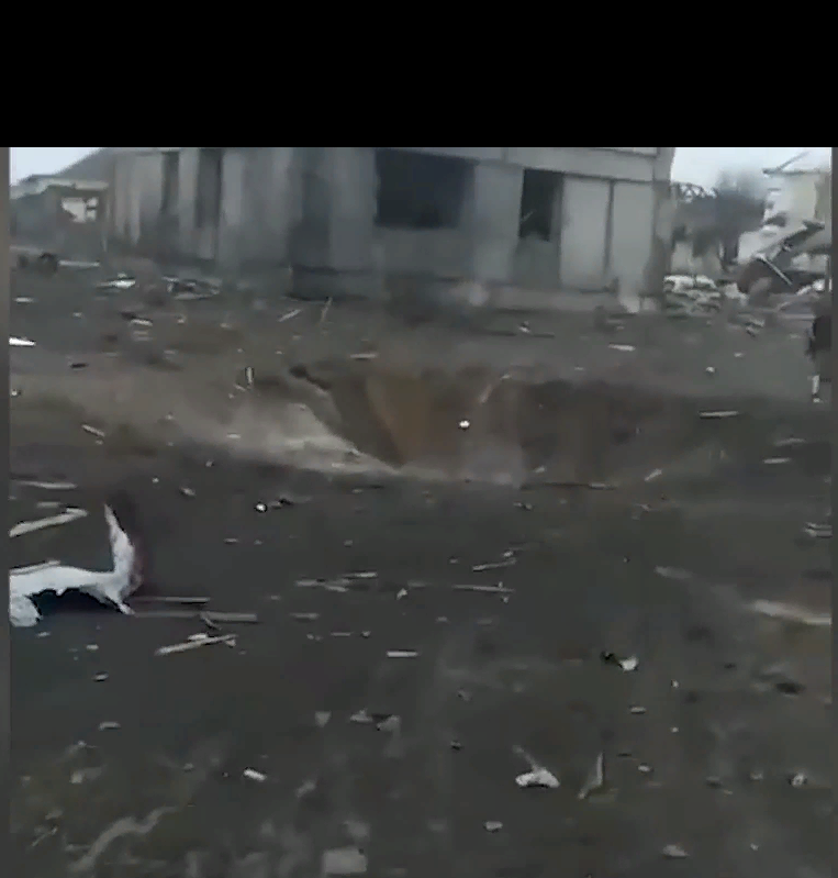 Место падения боеприпаса.