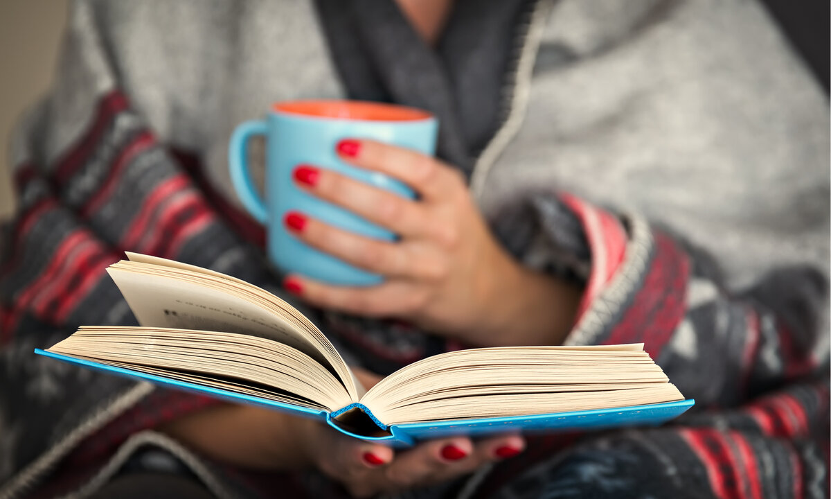 She is reading a book