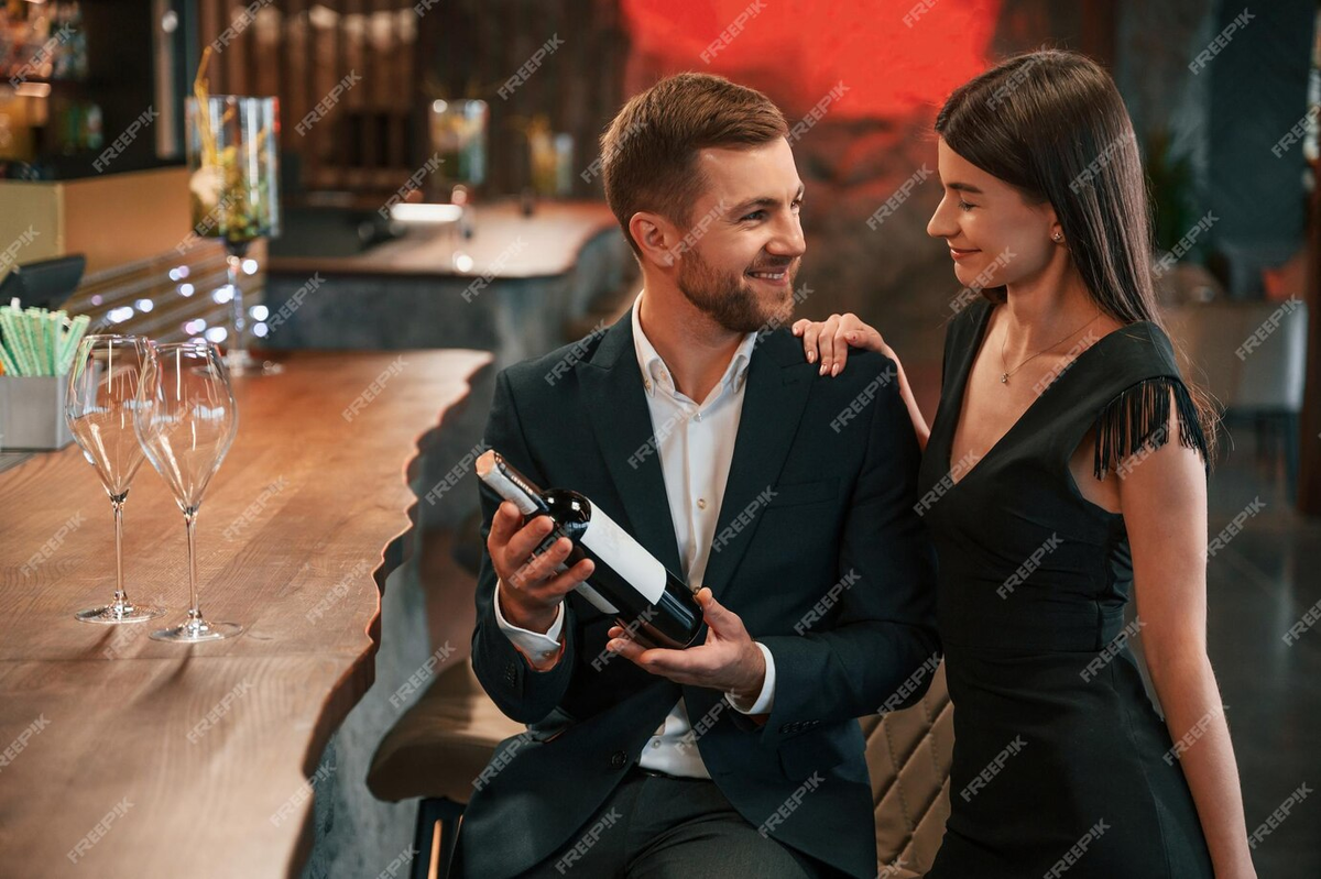 https://img.freepik.com/premium-photo/with-wine-bottle-man-and-woman-are-sitting-at-the-bar-with-alcohol-drink_146671-83206.jpg?w=1380