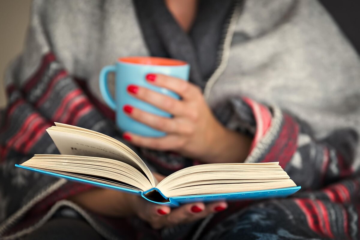 Ann is reading a book