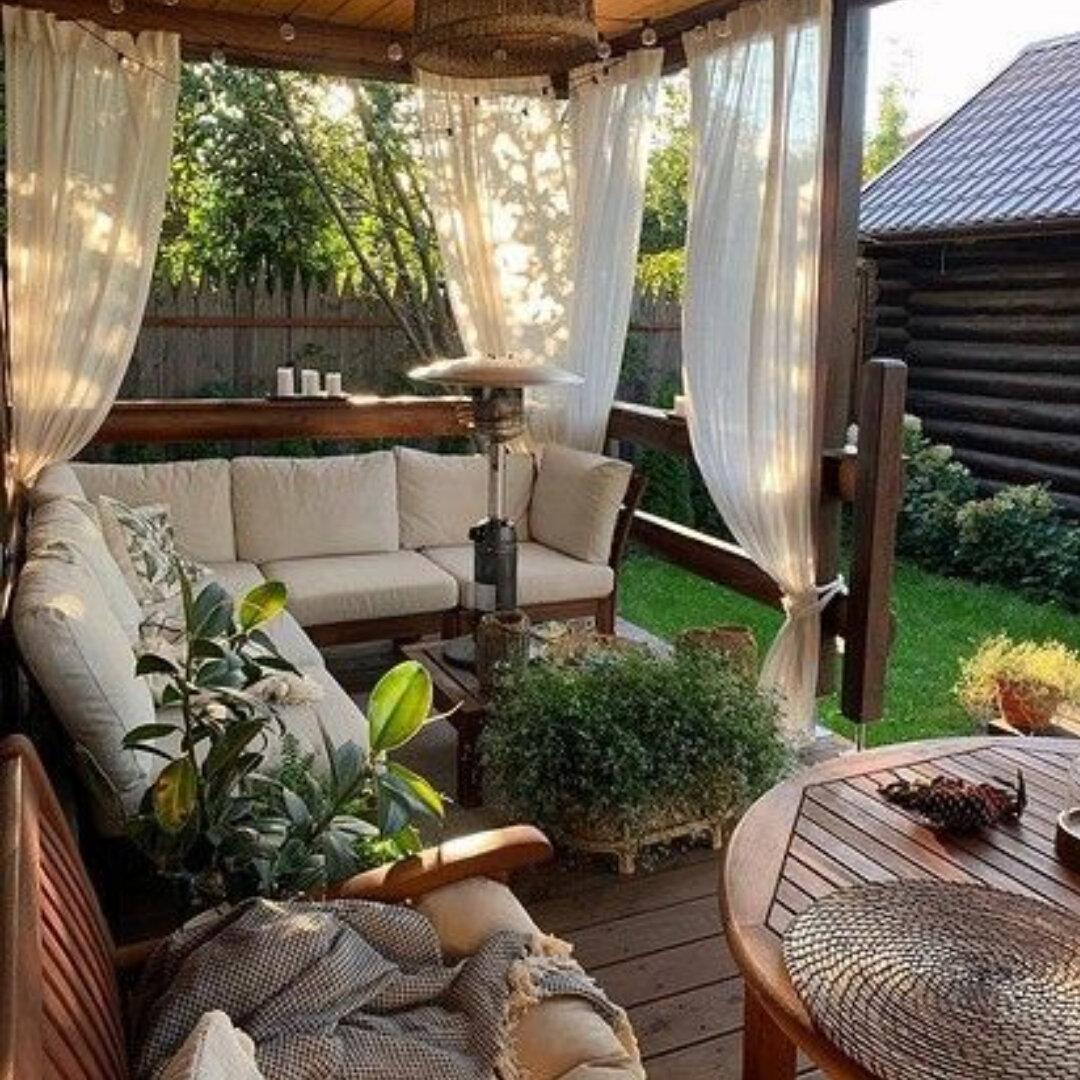 Homemade wooden gazebo, cobbles, garden lights, outdoor sofa, outdoor seating, a