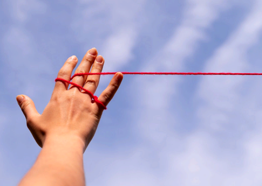 Image by <a href="https://www.freepik.com/free-photo/human-hands-connected-with-red-thread_34136514.htm">Freepik</a>