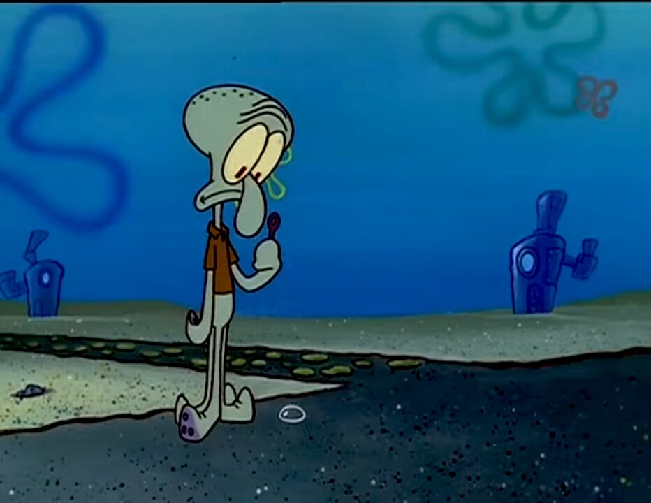 Сквидвард пытается надуть мыльный пузырь 