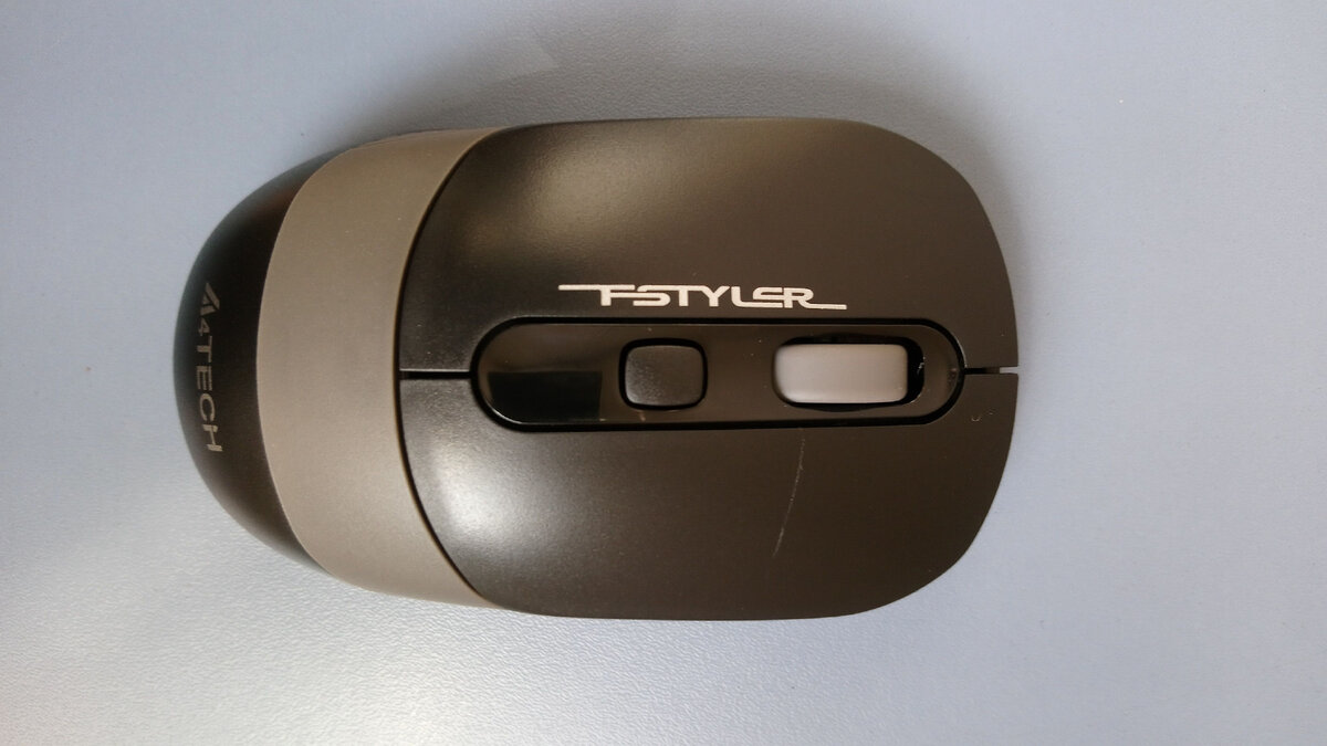 Рядом с колёсиком прокрутки кнопка изменения разрешения сенсора.