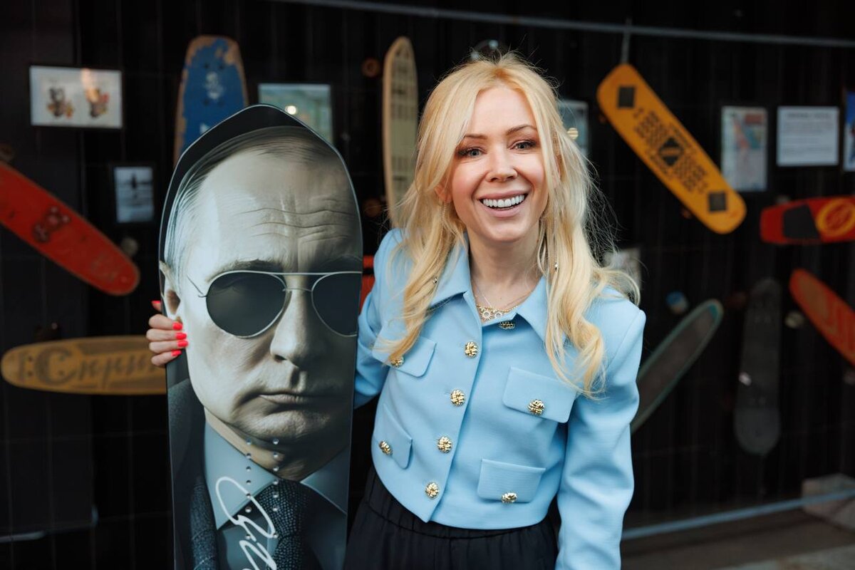 Екатерина пообещала принять вызов от спортсмена и встать на доску.  Фото: Мресс-служба правительства Тюменской области