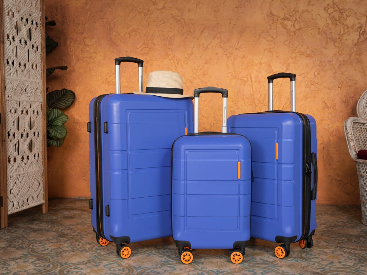 Bright colors not only help you find your suitcase on the luggage belt faster, but also make it a stylish accessory that complements your look and sets the mood. Source: Unsplash
