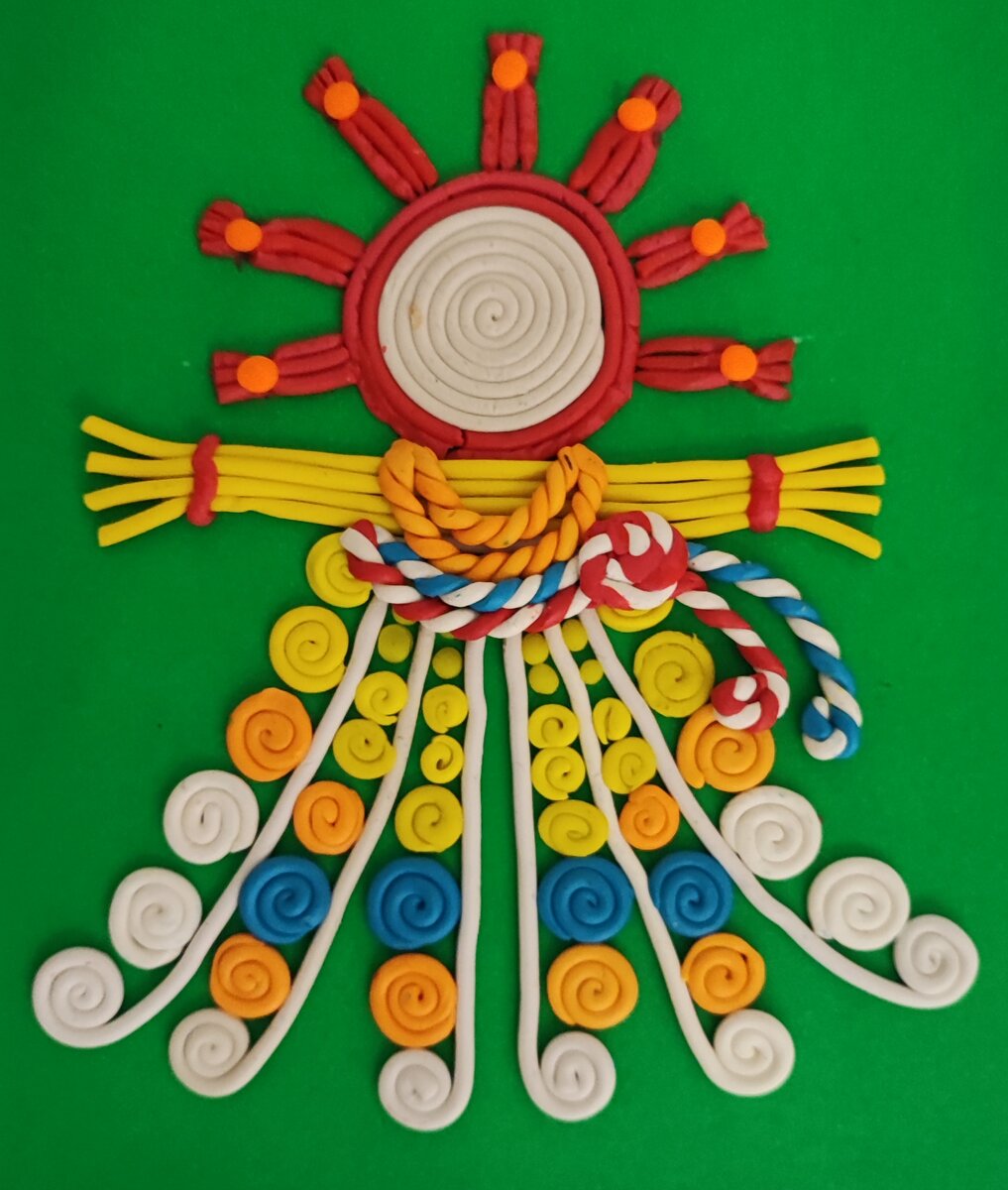 Готовый вариант аппликации из пластилина на цветном картоне Кукла - Масленица на канале Лепим с Таней.