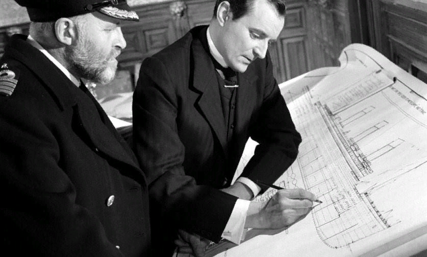 Сцена   из   фильма   «Незабываемая   ночь»   (1958   г.).   Томас   Эндрюс   подытоживает   свои   вычисления   и   выносит   смертельный   приговор   «Титанику».