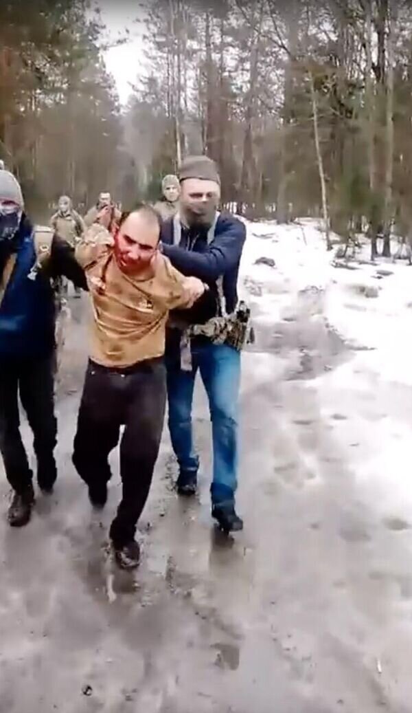 Кадр видео задержания причастного к теракту в "Крокусе"https://ria.ru/20240323/terakt-1935282135.html