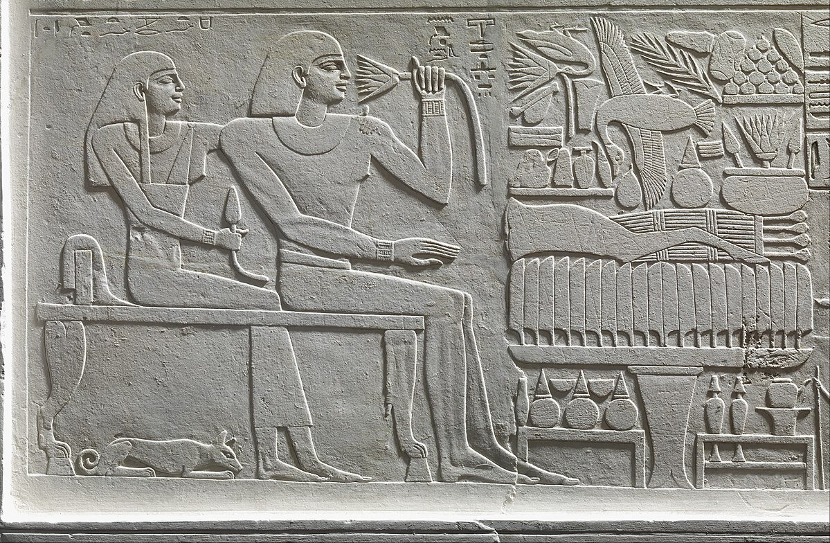 Stela of the Overseer of the Fortress Intef, detail showing Intef and his wife before the offering table. 2000–1988 B.C. Источник: https://www.metmuseum.org/art/collection/search/545393
