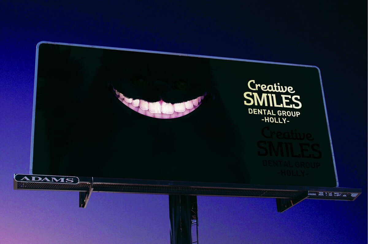 Этот рекламный щит представляет творческий подход к продвижению стоматологических услуг, на нем изображена огромная сияющая улыбка на темном фоне. Яркие зубы сверкают в темноте, а название "Creative Smiles Dental Group" игриво указывает на поставщика услуг. Это дерзкое напоминание о том, что днем или ночью яркая улыбка может быть вашим лучшим аксессуаром.
