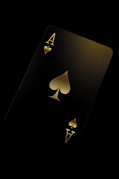 a black playing ace card with gold letters floating in the air, in the style of vray, grain, trace monotone, black, installation —chaos 10 —ar 2:3 —style raw —stylize 0