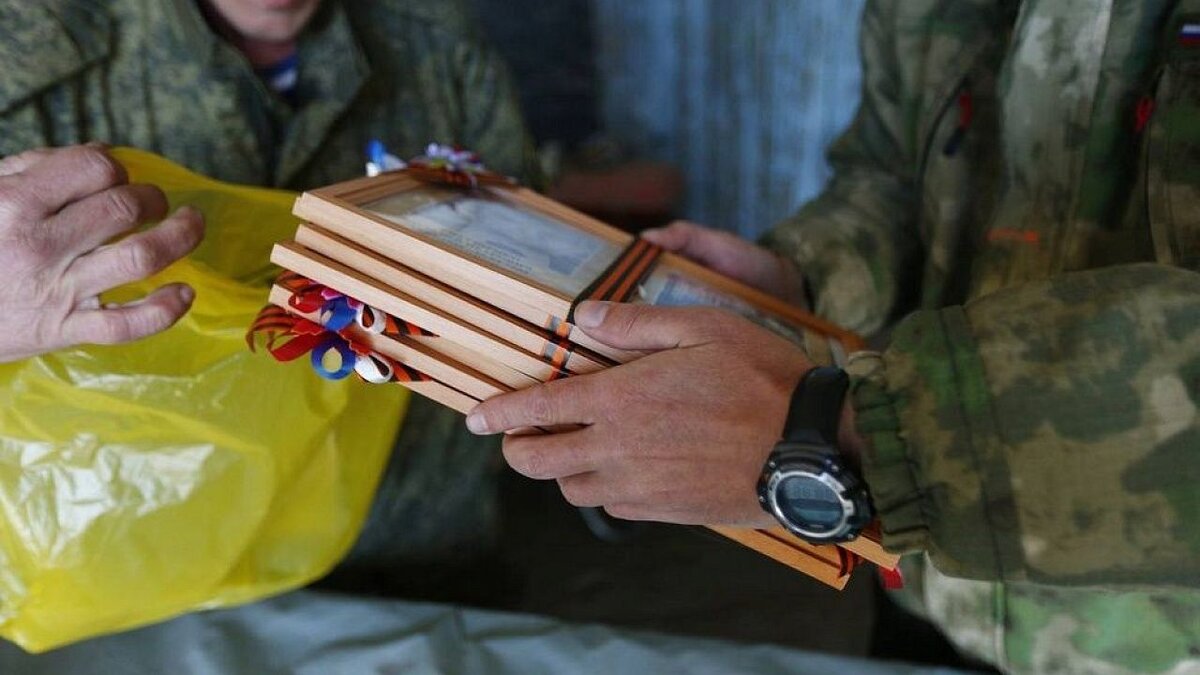    Казаки-добровольцы в зоне СВО провели акцию «Бессмертный полк». Фото: пресс-служба администрации Краснодарского края