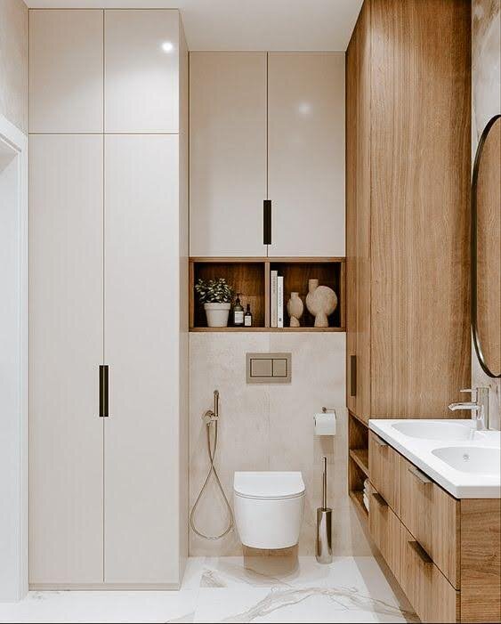 Шкаф вокруг инсталляции может занимать только глубину ниши или выступать, если вы планируете хранить там что-то большое, например вещи для уборки. 
