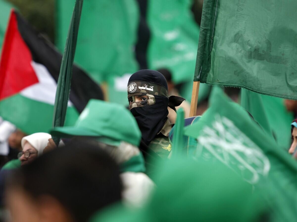    Сторонники ХАМАС на митинге в честь 10-летия со дня смерти духовного лидера группировки шейха Ахмеда Ясина в городе Газа. 23 марта 2014 года© AP Photo / Hatem Moussa