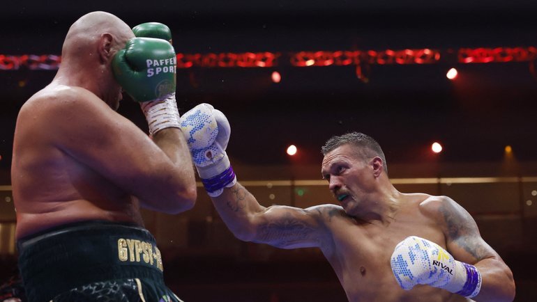    Тайсон Фьюри и Александр Усик. Reuters