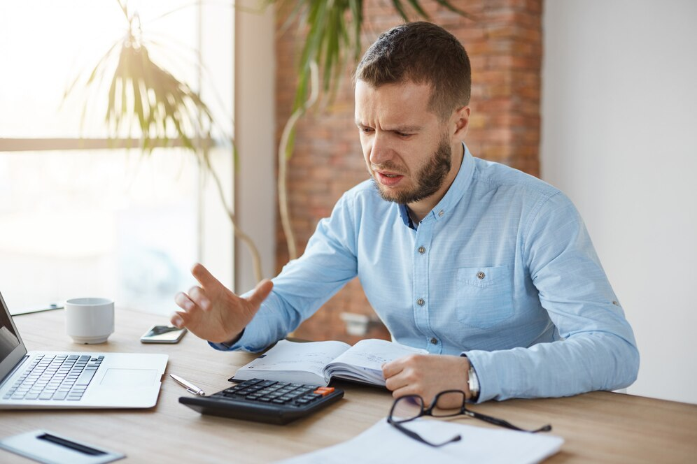 https://img.freepik.com/free-photo/portrait-unhappy-mature-bearded-accountant-working-company-office_176420-7928.jpg?t=st=1716278990~exp=1716282590~hmac=31ad61a2abca70ca98633b9fd6133957d9d4bbd153572d127a980d1703117401&w=996
