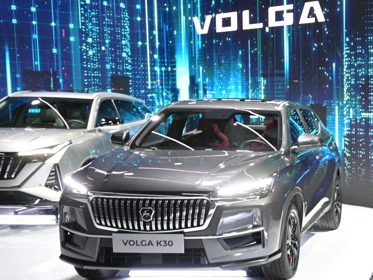    Новый автомобиль Volga К30 в павильоне марки VOLGA на выставке IX конференции "Цифровая индустрия промышленной России" в Нижнем Новгороде© РИА Новости / Александр Астафьев