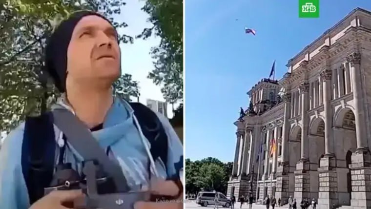 На фото зафиксирован момент из видео, когда над рейхстагом в небе поднимается российский флаг, прикреплённый к дрону. Само видео можно посмотреть на сайте Хакнем по ссылке: https://haknem.ru/explore-russia/trikolor-nad-rejhstagom-kto-zapustil-dron-s-rossijskim-flagom-v-berline/