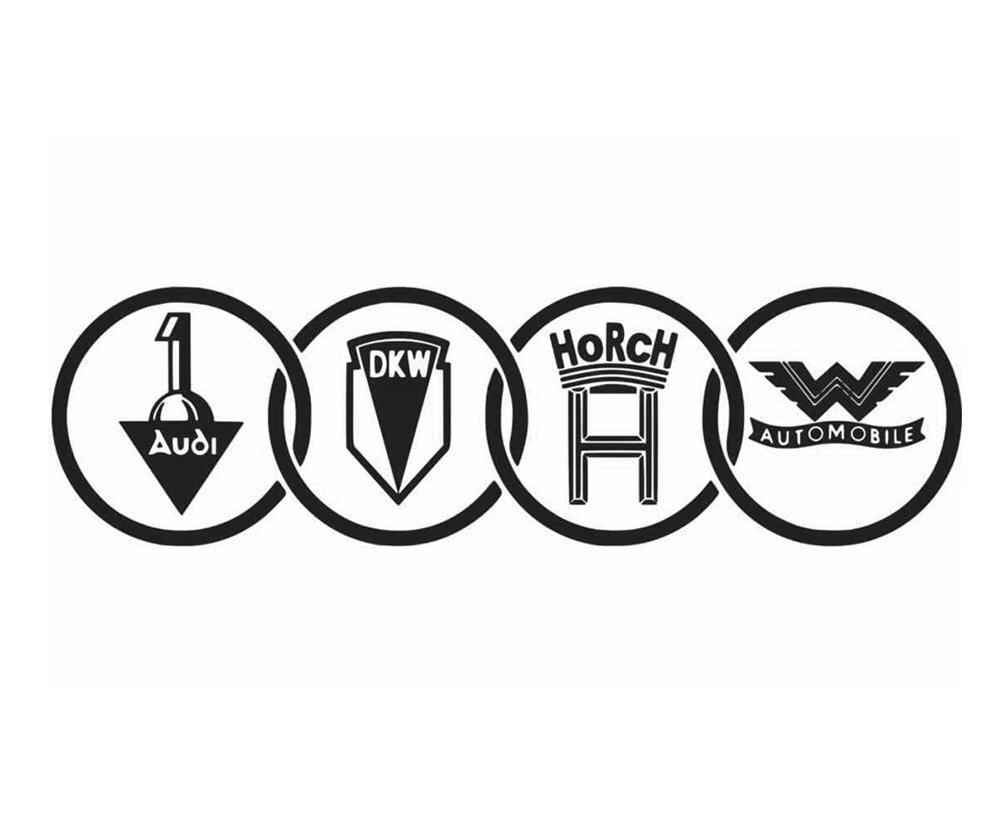    Более привычные нам четыре кольца появились спустя два с лишним десятилетия, когда Audi объединилась еще с тремя немецкими автопроизводителями Horch, DKW и Wanderer, образовав союз Auto Union AG. Собственно, их и символизировали эти кольца. Вписанные в окружности логотипы фирм наглядно поясняли смысл общей эмблемы.