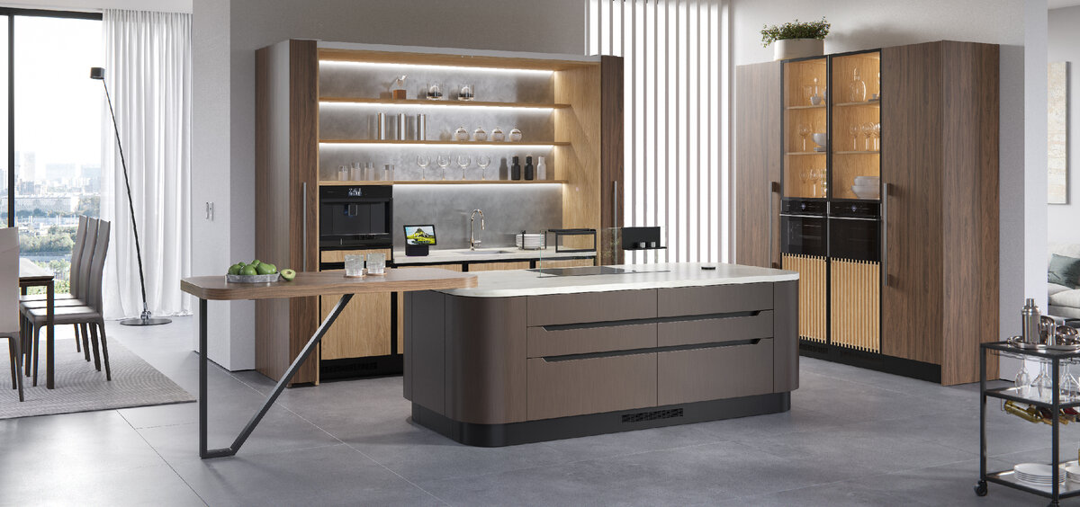 Пристенная часть с зоной готовки оснащена новым механизмом задвижных дверей. Он позволяет одновременно открывать и закрывать две соединенные между собой двери, обеспечивая доступ в к шкафам и открытым полкам в нише шириной 2400мм. Система магнитного контроля и стабилизации движения обеспечивает максимально плавное движение. При желании механизм можно дооснастить электротолкателями.