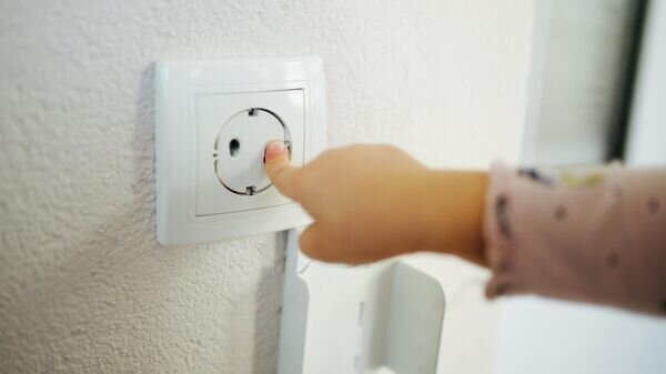    CC BY 2.0 / Nenad Stojkovic / Young girl touching a protective outlet