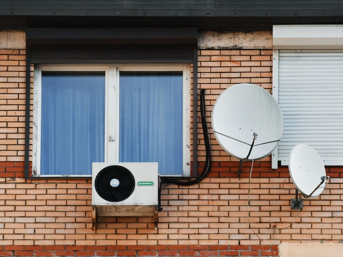    Кондиционер на стене жилого дома© РИА Новости / Михаил Воскресенский