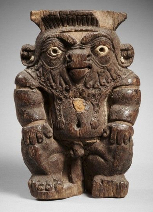 Рис.1 Фигурка  карлика Бэса из дерева и слоновой кости. Седьмой-первый века до нашей эры.   Художественный фонд Гандура, Женева. Фотограф: Тьерри Оливье (Thierry Ollivier)