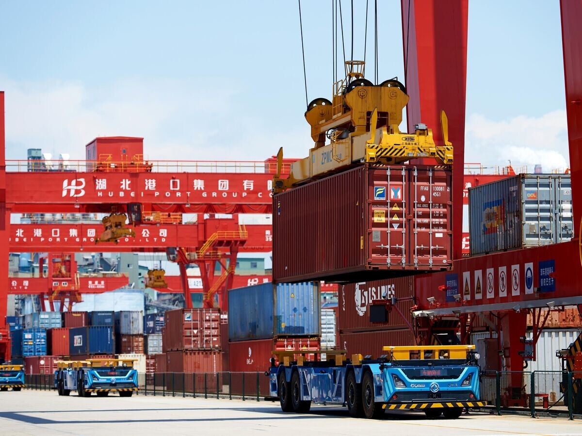    Платформы для железнодорожных контейнеров в порту Янло в Ухане© РИА Новости / Анна Раткогло