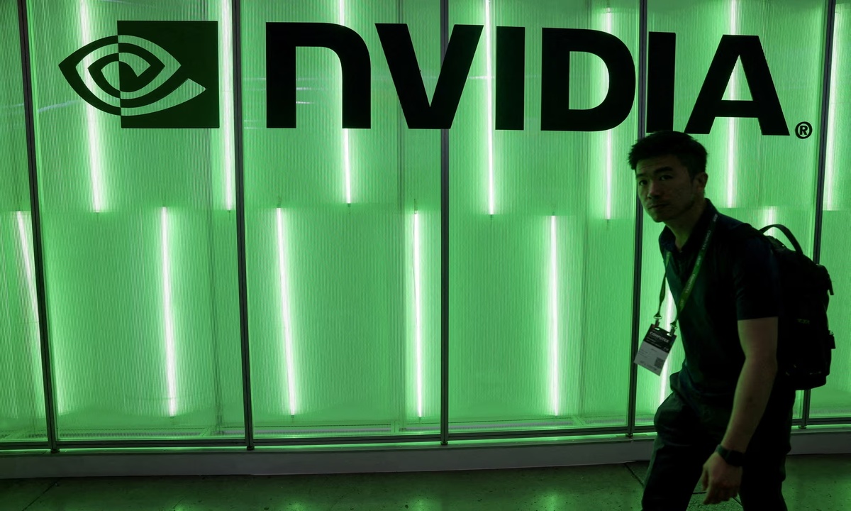 A person walks pass a Nvidia logo at Computex in Taipei. Photograph: Ann Wang/Reuters