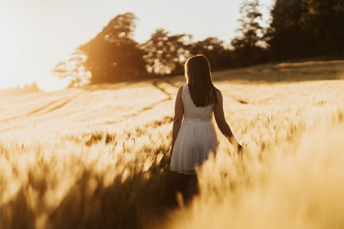 https://unsplash.com/photos/woman-in-white-dress-standing-on-brown-grass-field-during-daytime-4oq1VnUB1F0