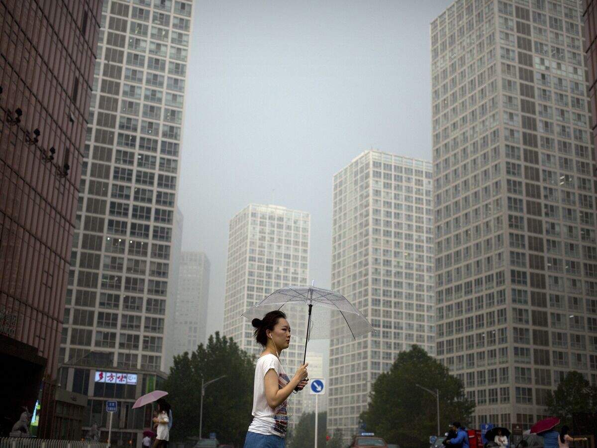    Дождь в Пекине. 11 августа 2017© AP Photo / Mark Schiefelbein