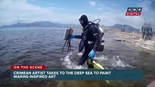 Painting under water_ Crimean artist takes to the deep sea to paint marine-inspired art _ ANC