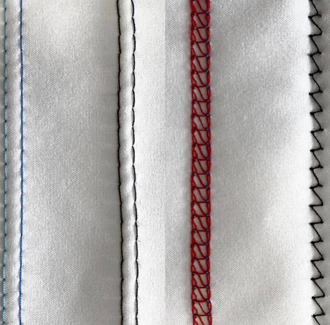 Слева цветной шов - распошивальная машина, черный - двойная игла. 