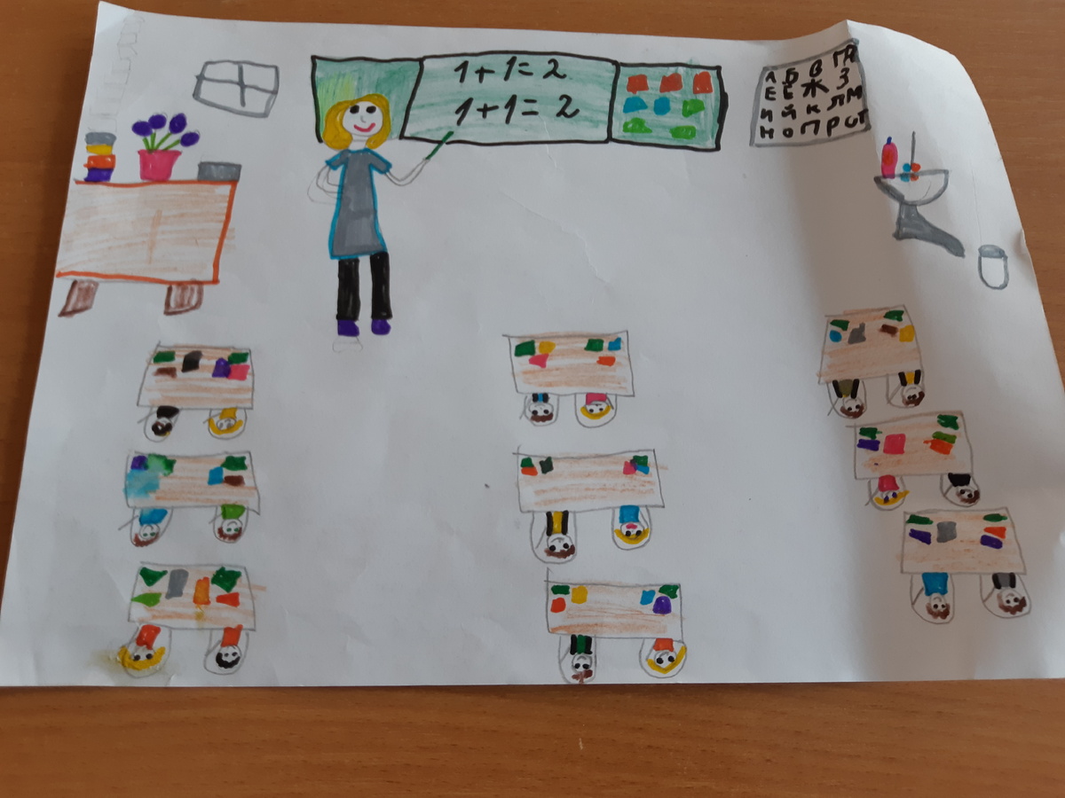 Фото автора. Это так меня ученики нарисовали,. Храню рисунок.