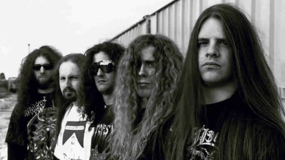 Cannibal Corpse в 1996 году: (слева направо) Пол Мазуркевич, Джек Оуэн, Роб Барретт, Алекс Вебстер, Джордж "Корпсегриндер" Фишер