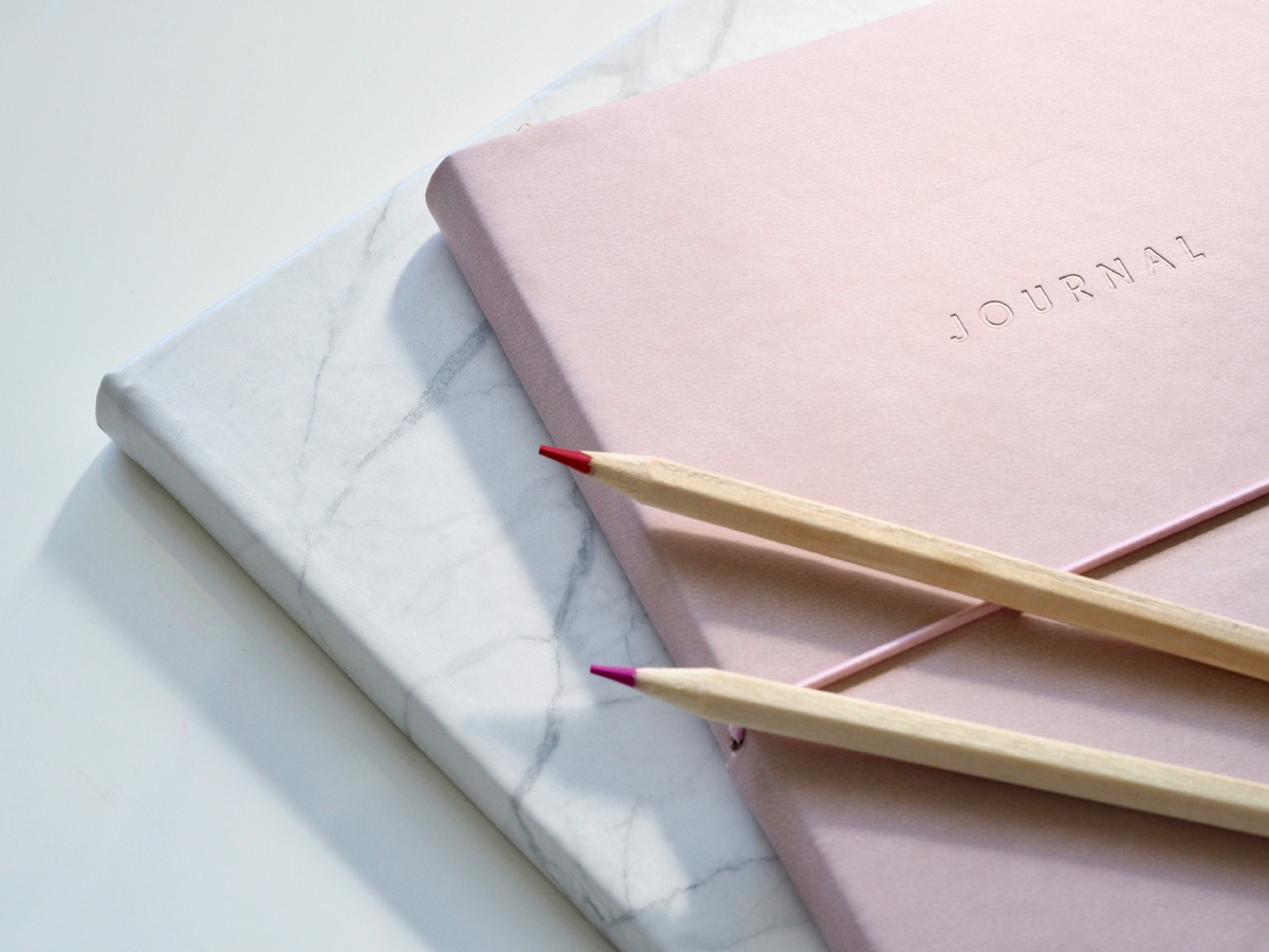 https://unsplash.com/photos/red-and-purple-coloring-pencils-on-pink-journal-y7GlIdTUOvo