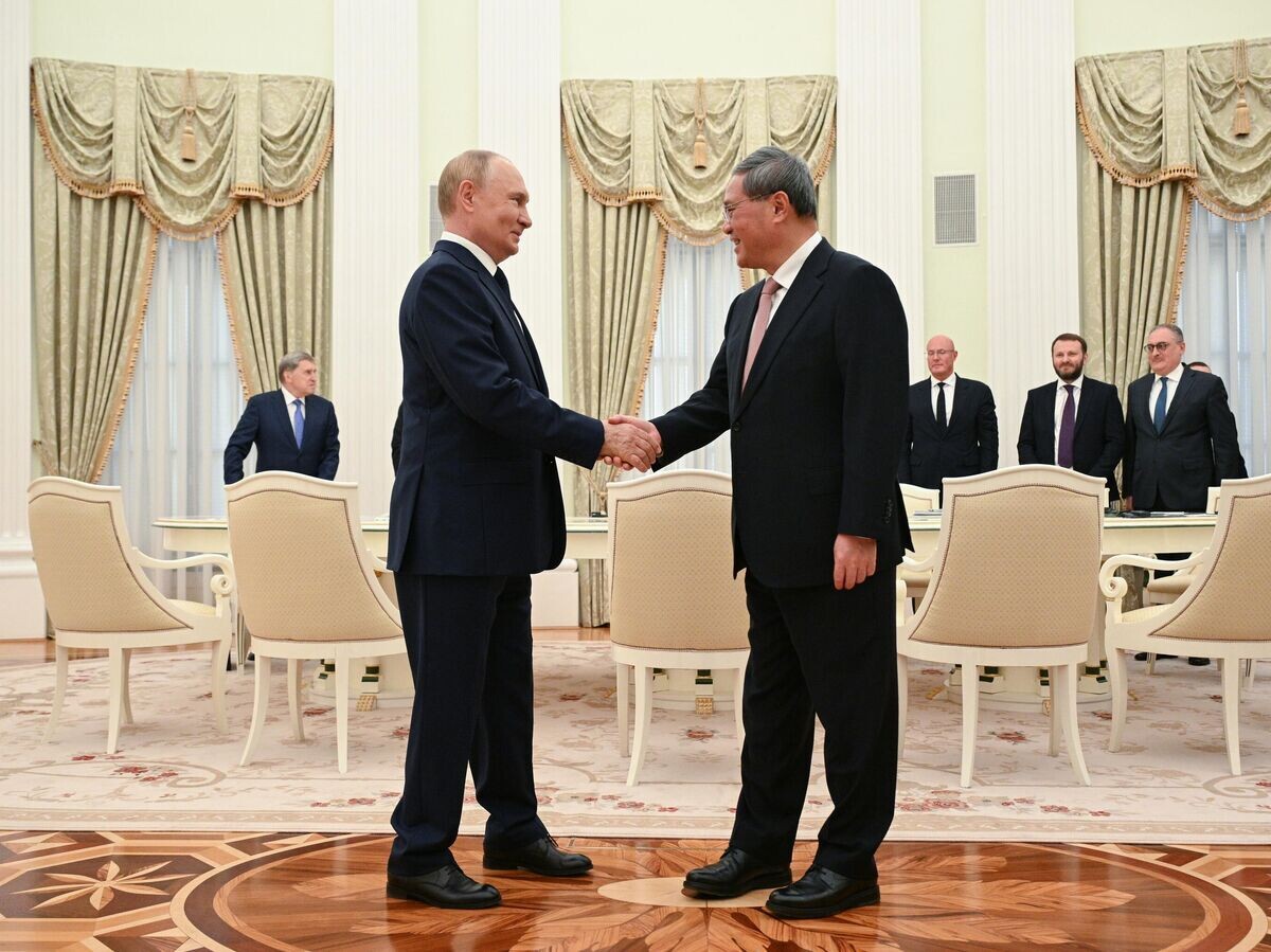    Президент РФ Владимир Путин и премьер Государственного совета Китая Ли Цян во время встречи© РИА Новости / Алексей Филиппов