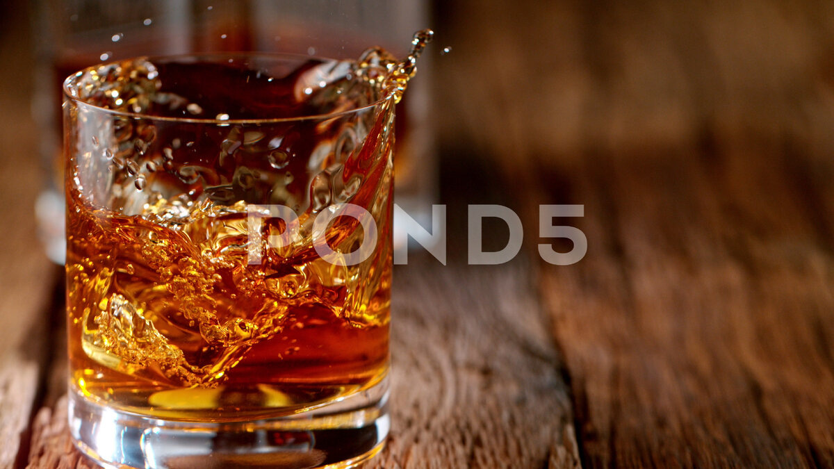 https://www.pond5.com/stock-footage/item/146113733-pouring-whiskey-vintage-wooden-table-super-slow-motion