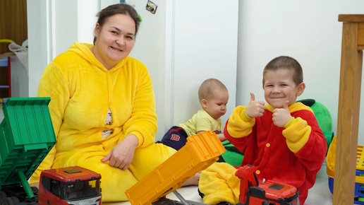 The child changes places with his mother and cleans the apartment after her