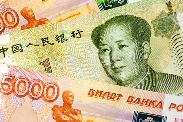 https://st2.depositphotos.com/3125791/8122/i/450/depositphotos_81229582-stock-photo-rubles-and-yuan-banknotes.jpg